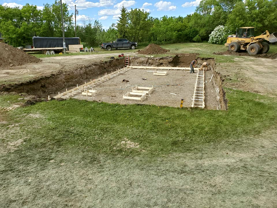 Preparing a basement foundation.